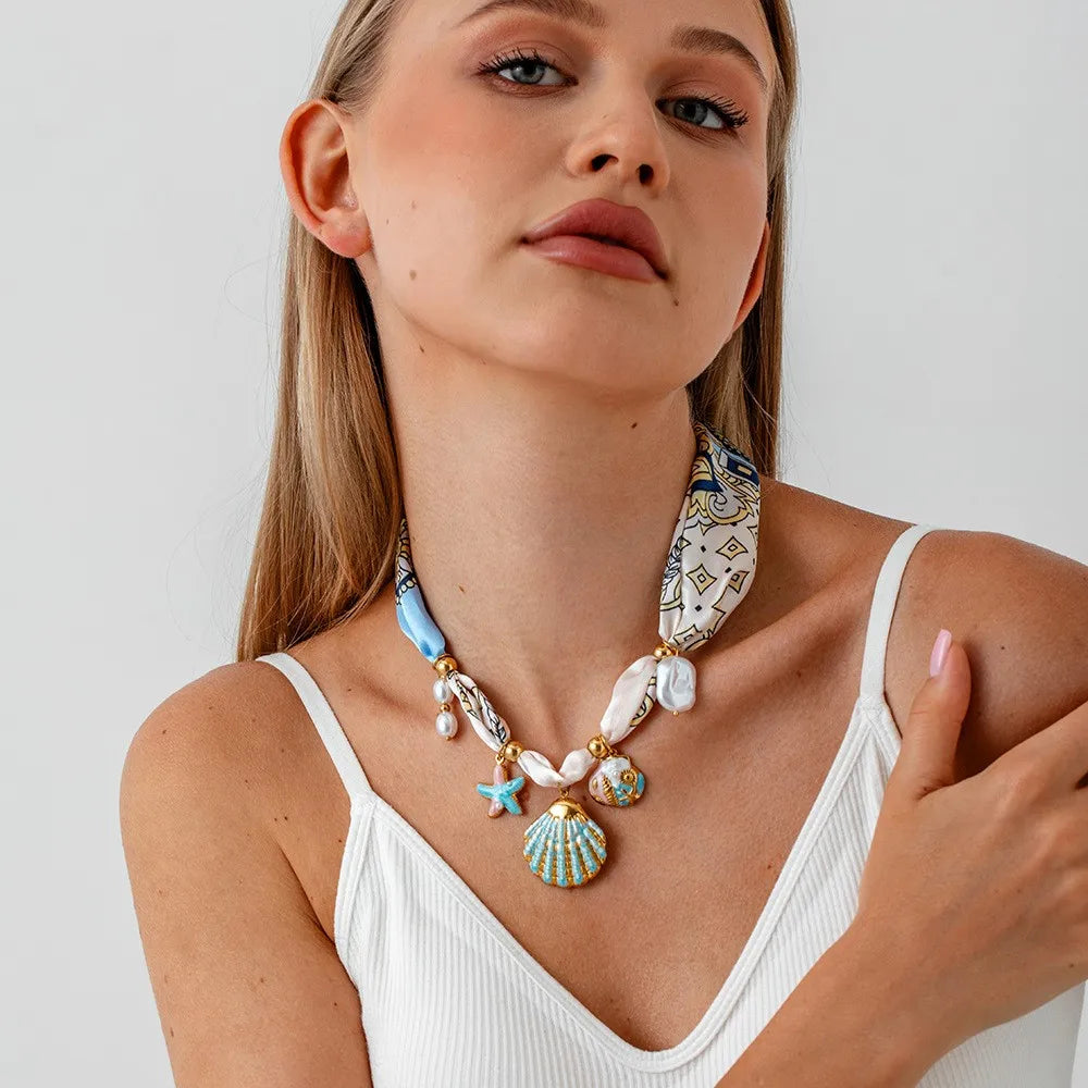 Colar Ocean Colors – Estrela-do-Mar e Concha Esmaltadas em Aço Inox Banhado a Ouro 18K